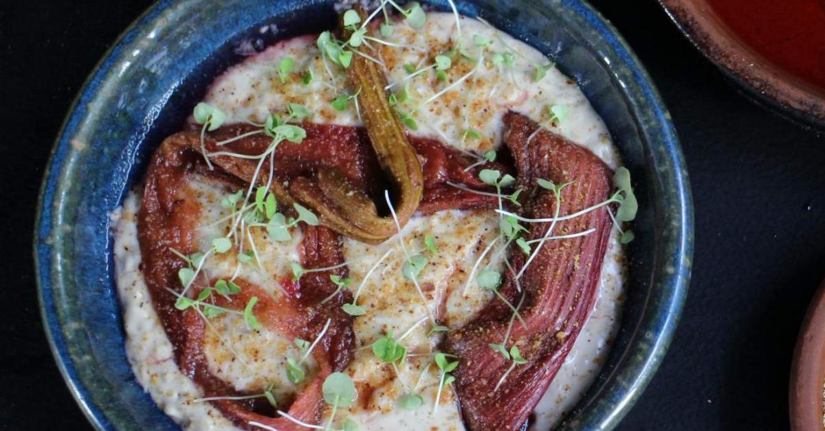Warm almond milk rice pudding with rhubarb and rose by Matt Stone. A